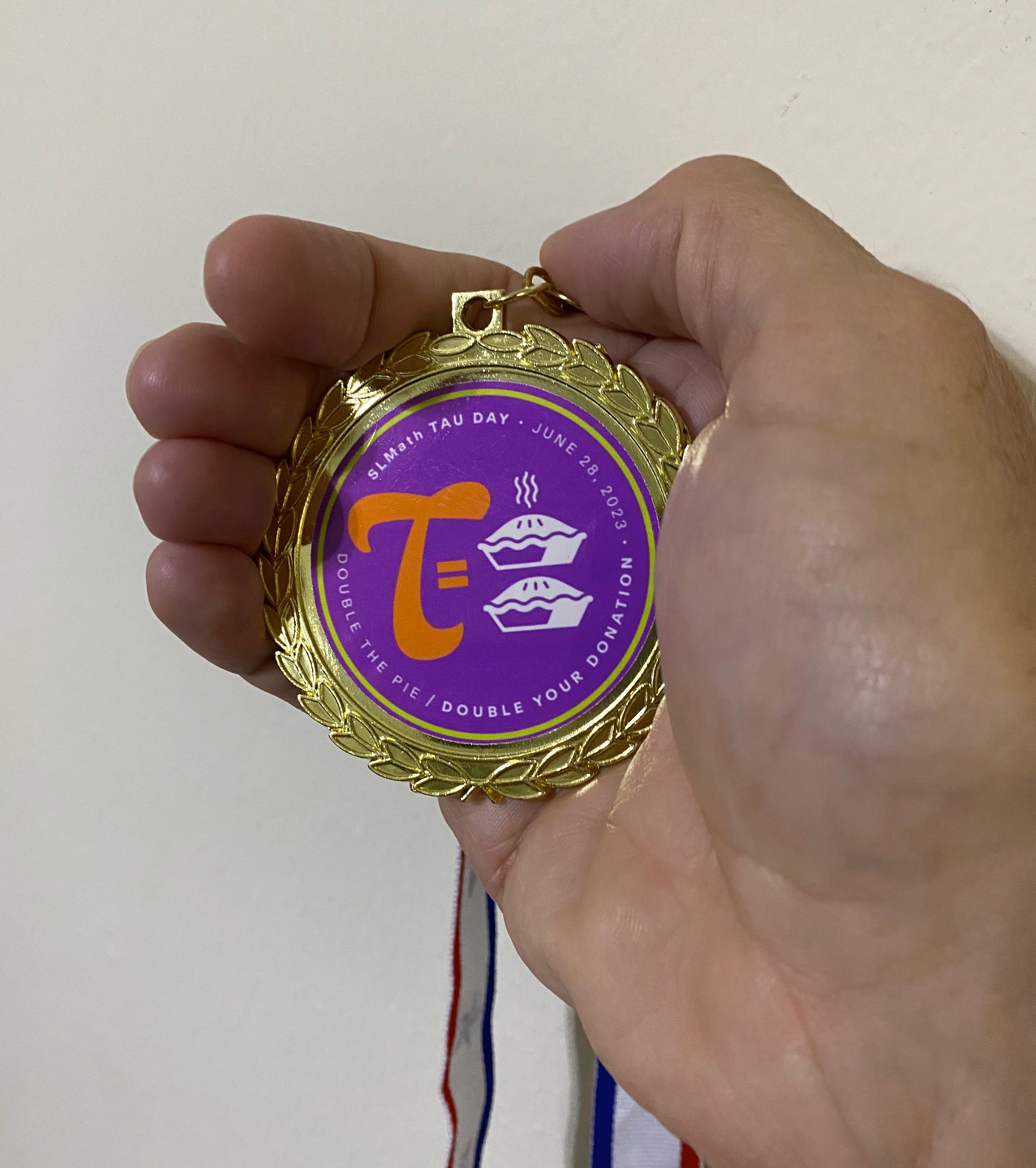 Tau Day medal from SLMath